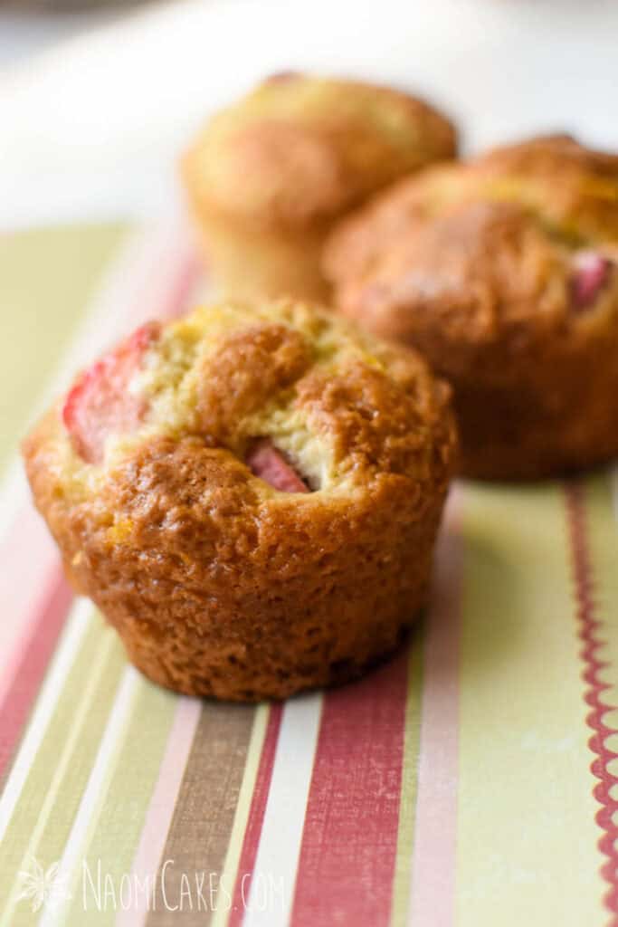 rhubarb muffins on a striped paper background