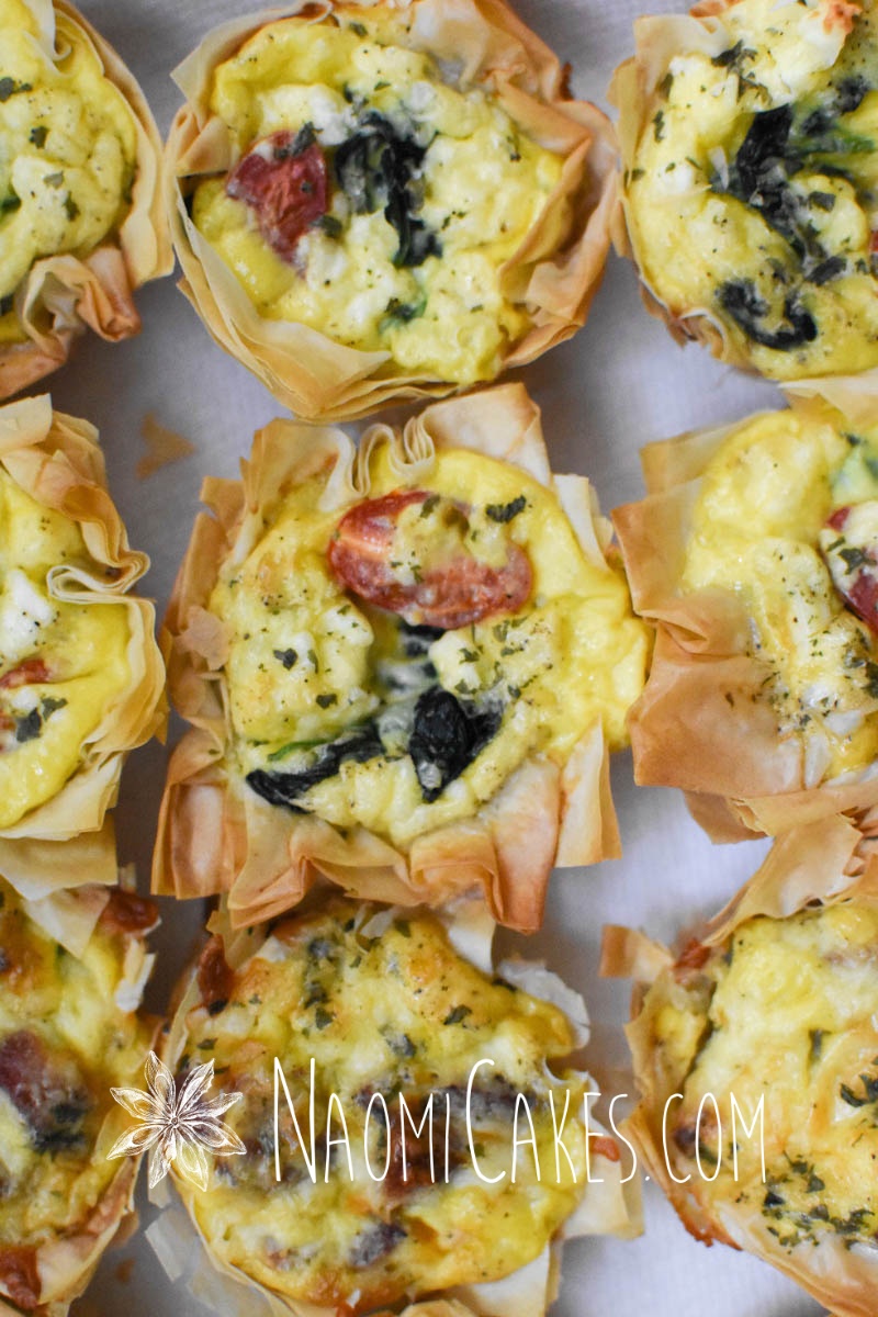 miniature quiche with spinach, tomato and feta cheese