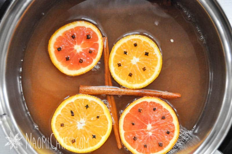 pot of apple cider with mulling spices