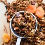 white cup full of chunky fruit and nut granola