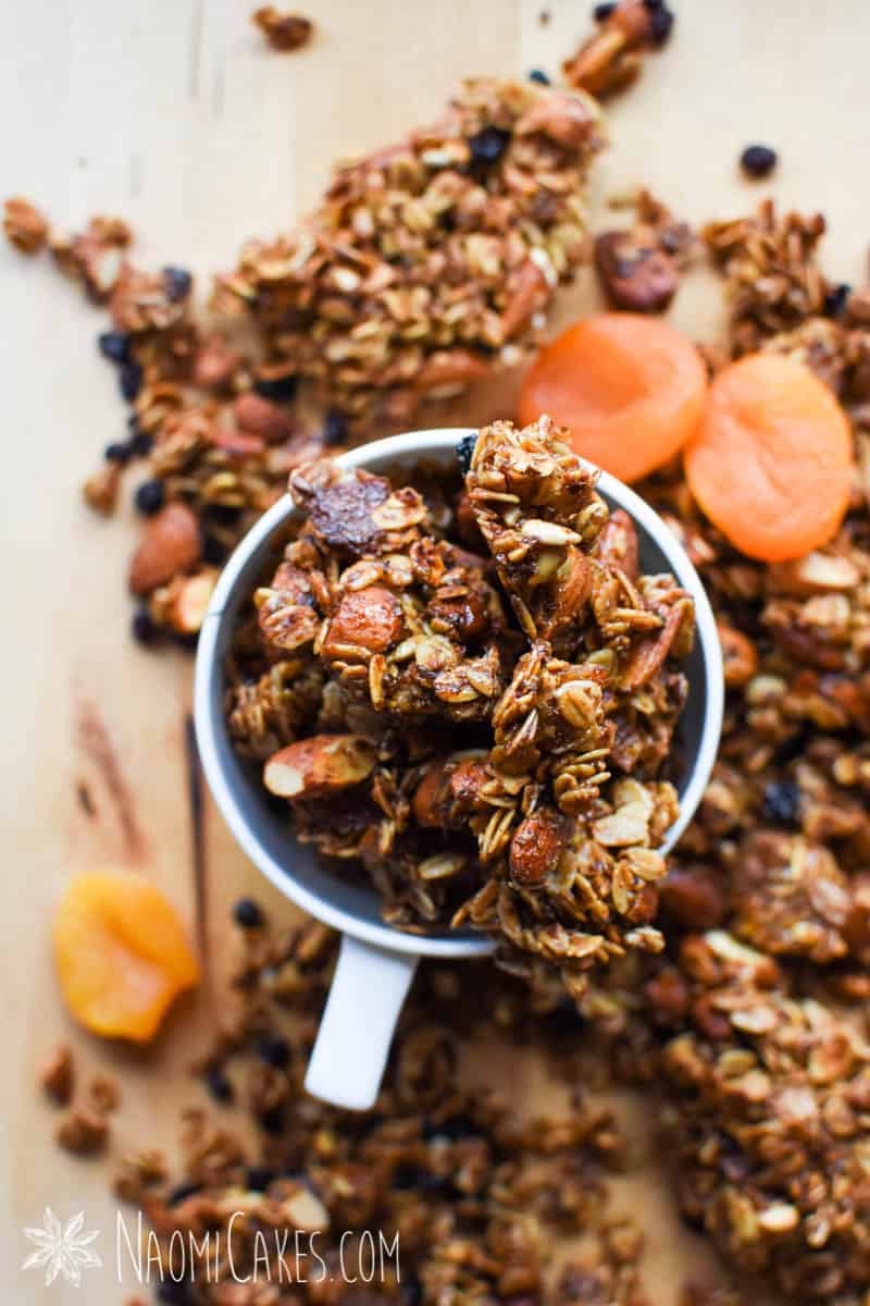 white cup full of chunky fruit and nut granola