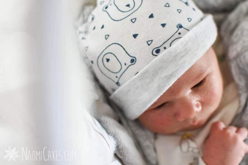 baby in a bear hat as a featured image in an unmedicated VBAC birth story