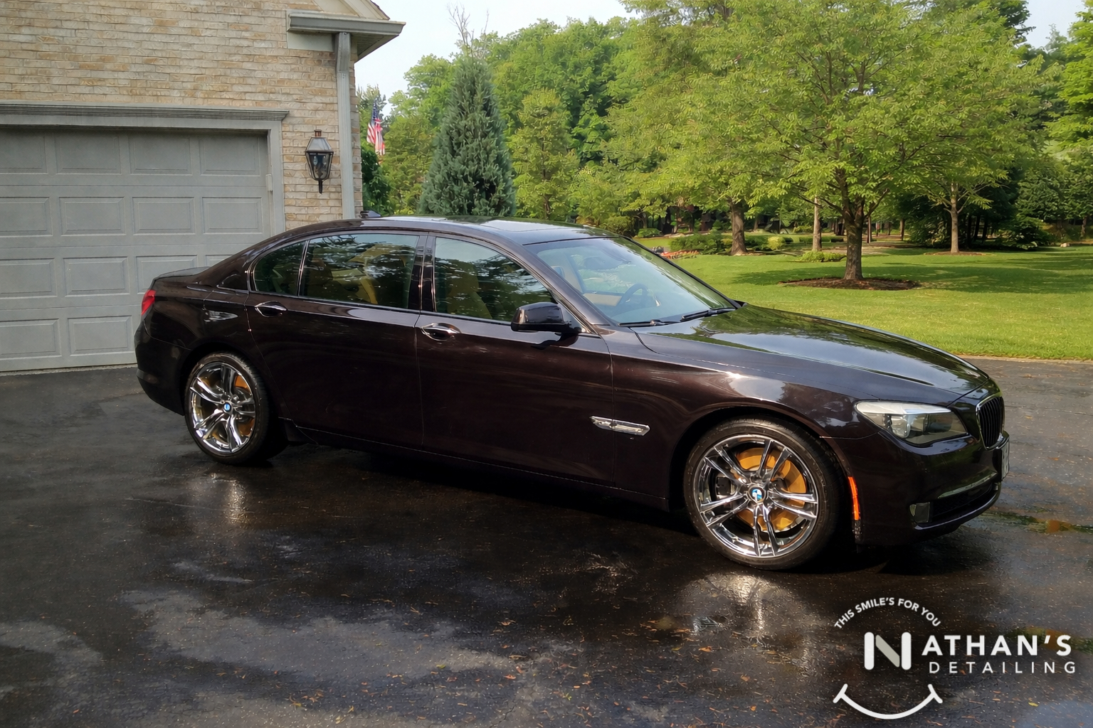 Bmw sedan glossy paint wet driveway during mobile detailing