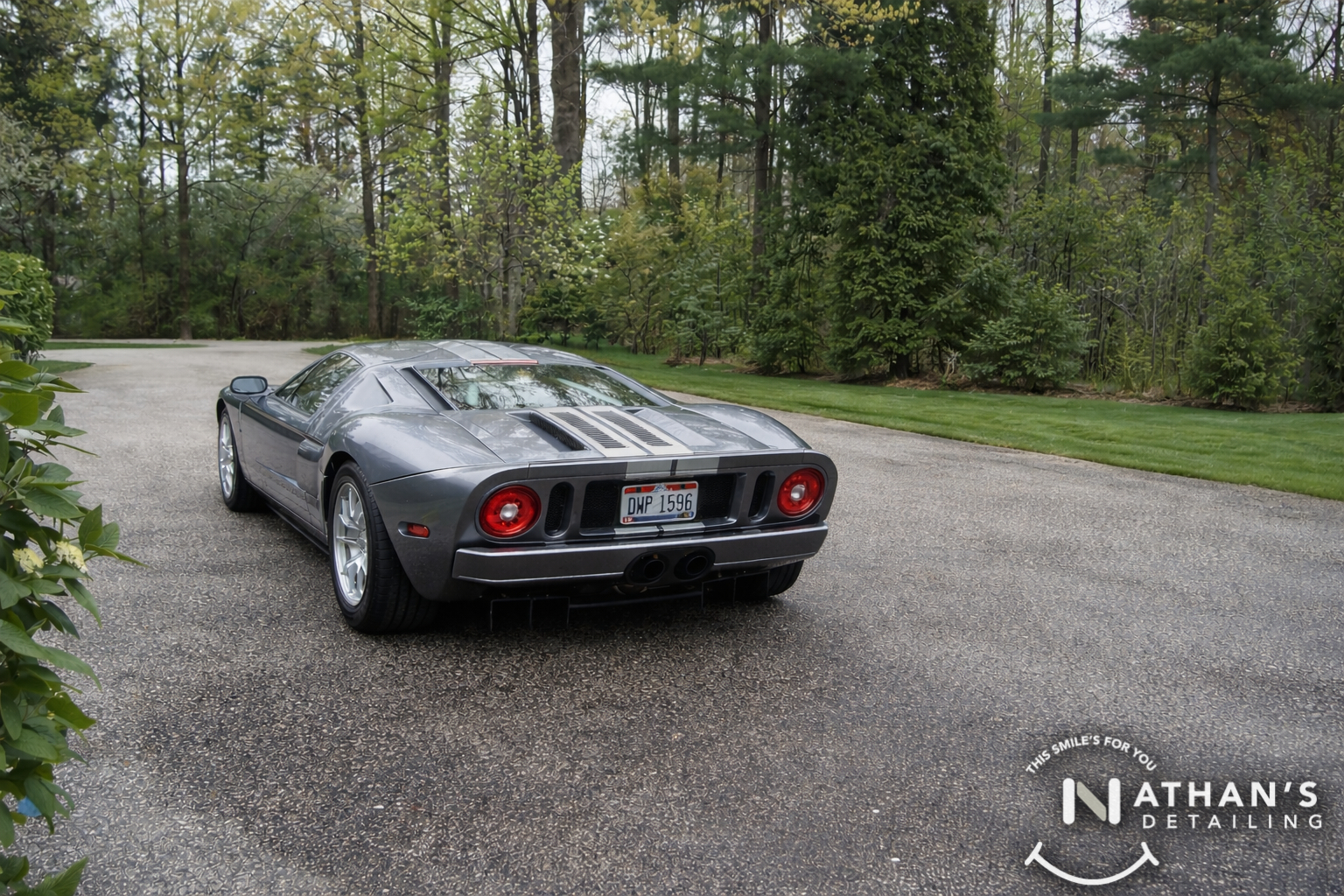 Gray supercar rear view after detailing during mobile detailing
