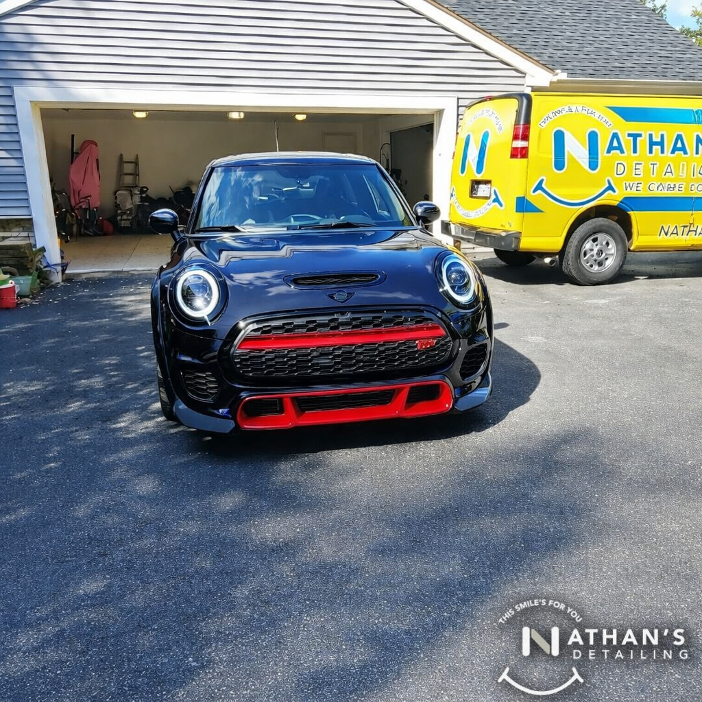 Mini cooper front view in driveway during mobile detailing