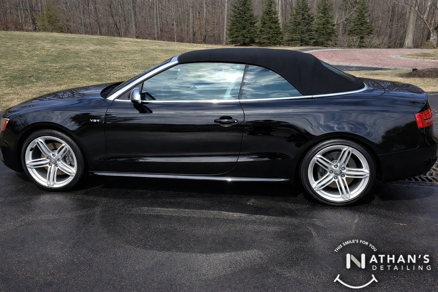 Black audi convertible polished side view during mobile detailing