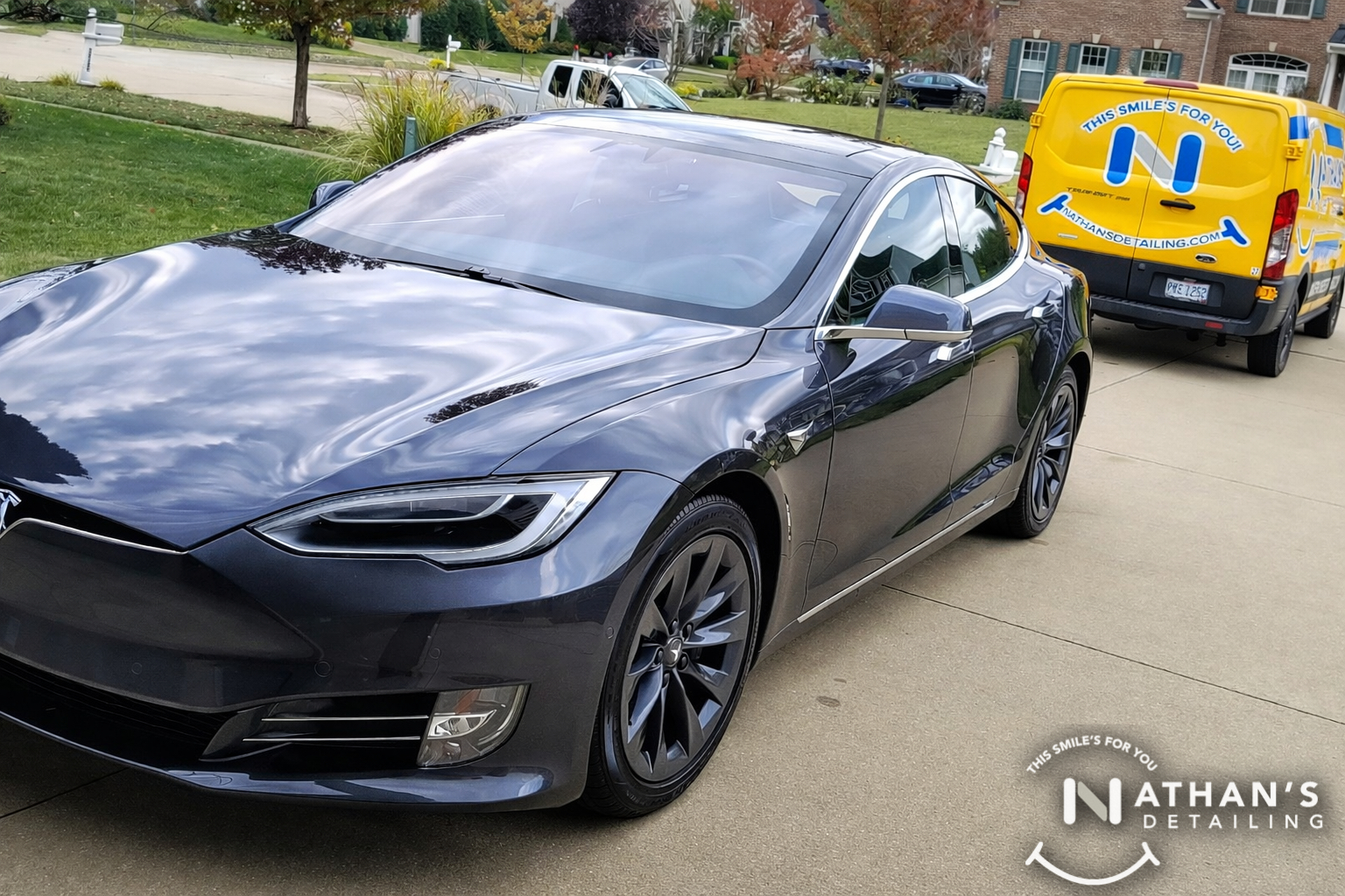 Glossy tesla sedan after mobile detail during mobile detailing