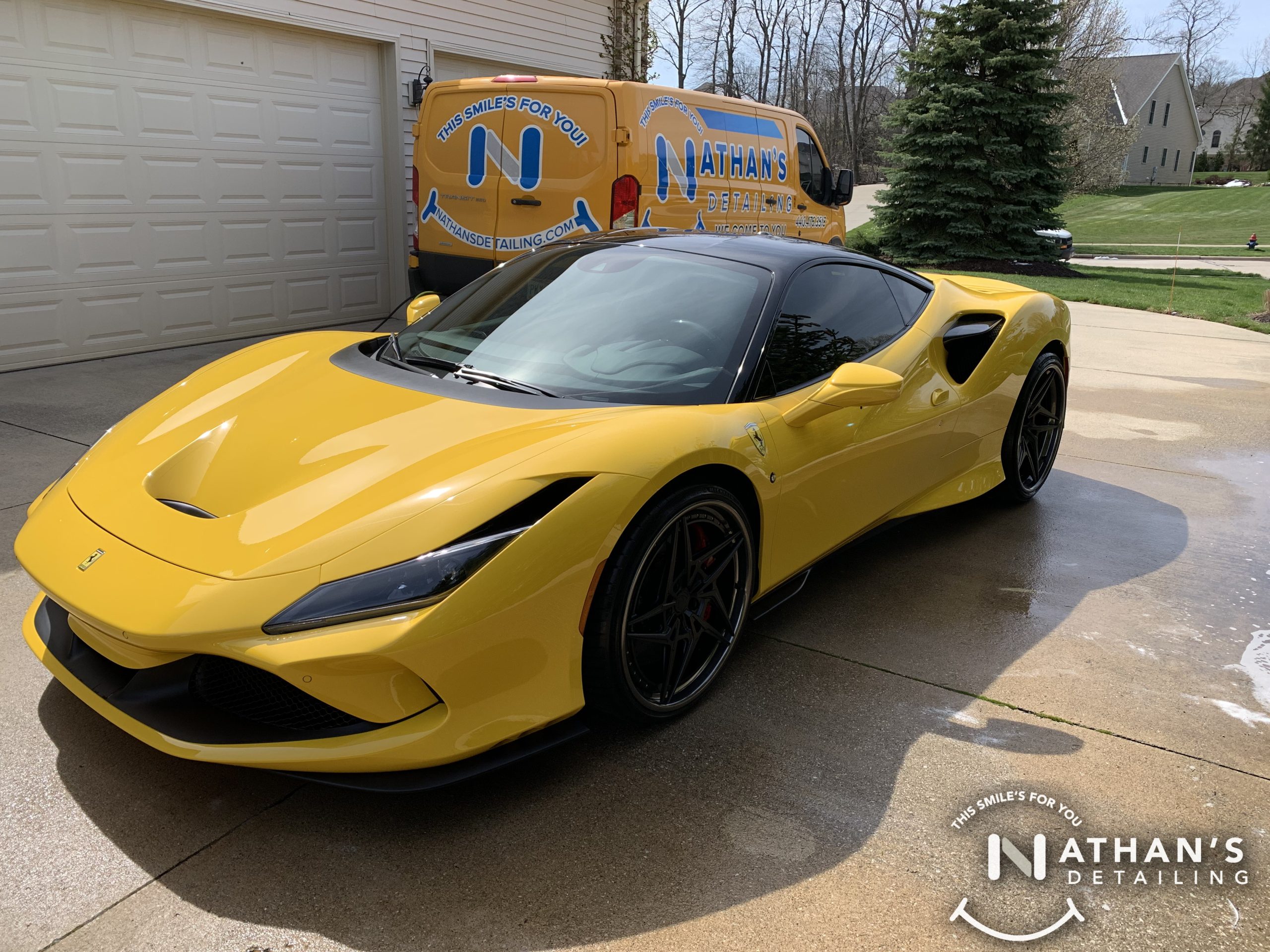 Polished yellow sports car in driveway during mobile detailing