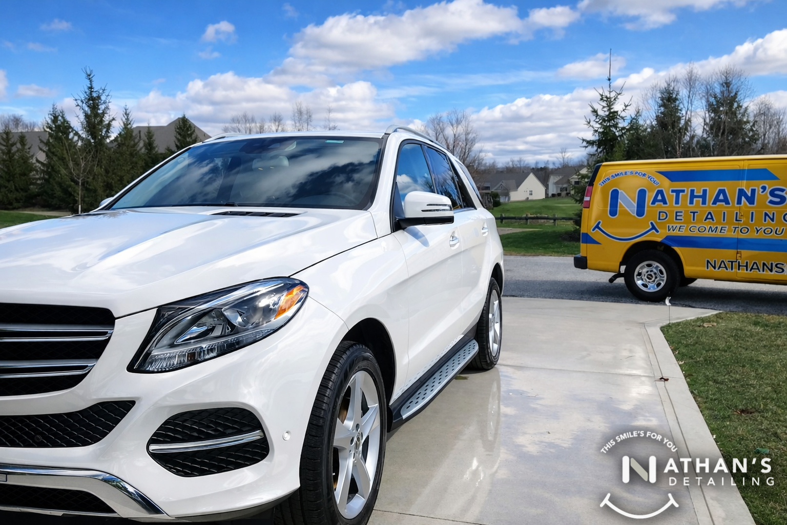 White suv on driveway after mobile detail during mobile detailing
