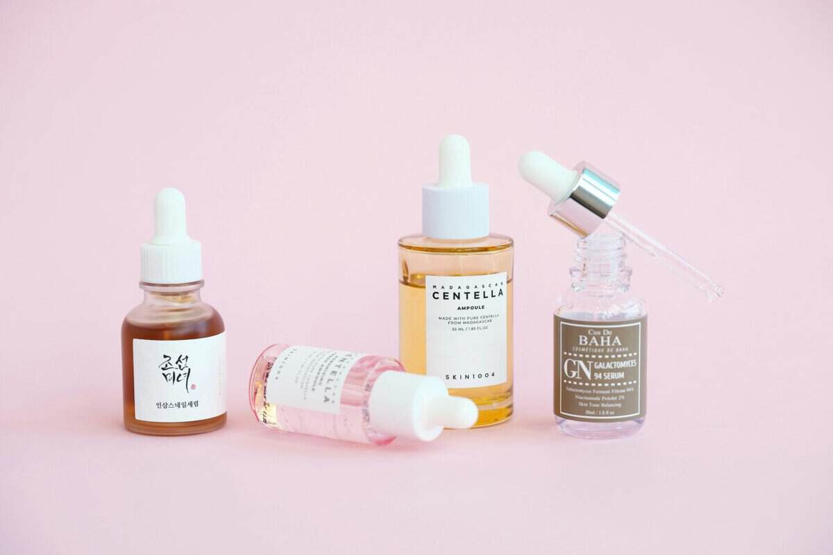 image of korean skincare products on display in front of a pink background