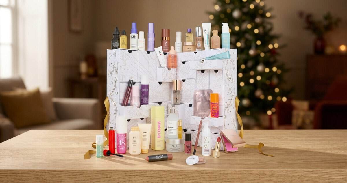 Cult Beauty Advent Calendar 2026 with its drawers open and products on a table by a lit Christmas tree, including BYOMA, The Ordinary and Medik8