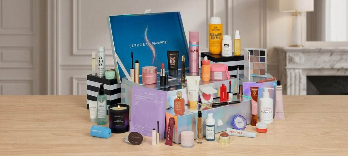 Sephora Advent Calendar 2026 open with its 40 products arranged around the blue Sephora Favorites box, including Sol de Janeiro, K18 and Topicals