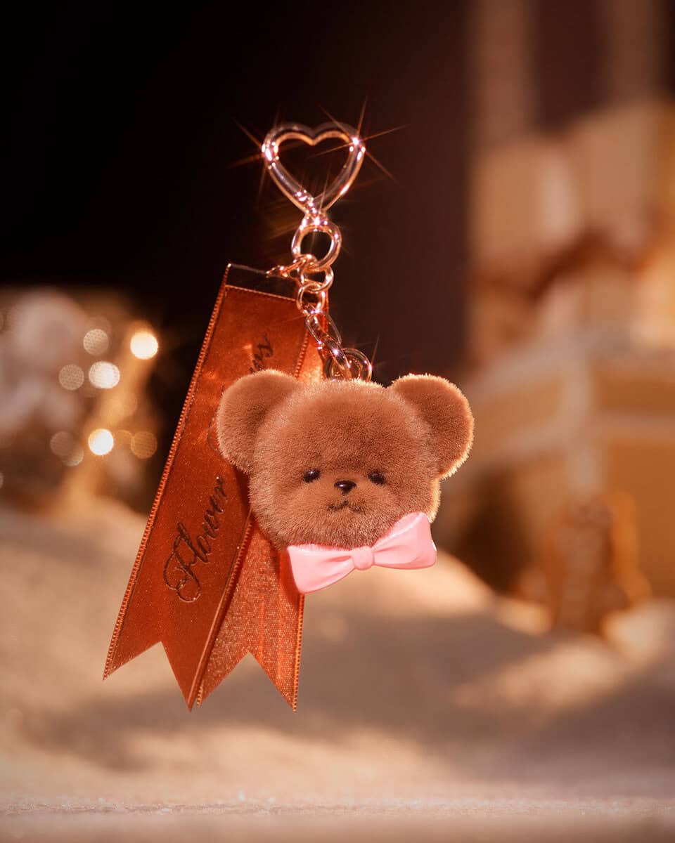 Close up of the Flower Knows bear charm that comes with the Christmas Solid Perfume in Dewy Rose