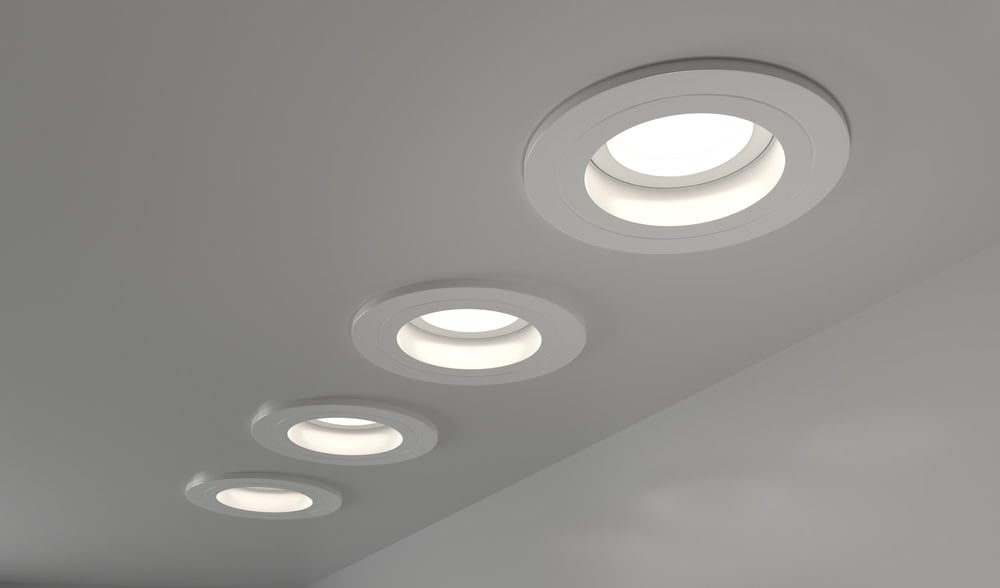 Sleek, modern recessed ceiling lights casting a soft, ambient glow.