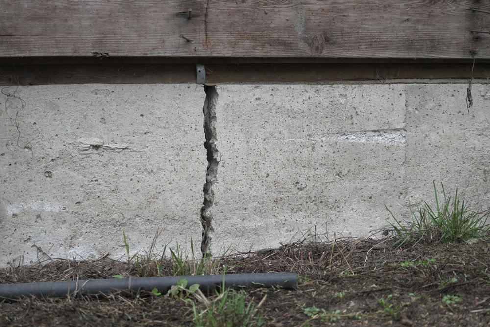 Foundation flaw: A widening crack in the concrete base.
