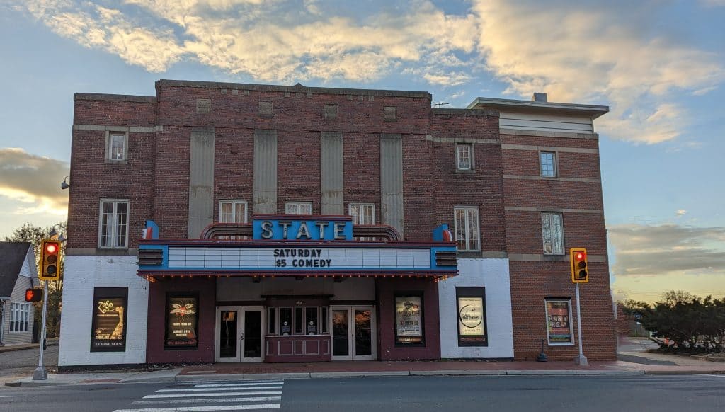 The historic State Theatre marquee advertising a Saturday comedy show, in Falls Church, Virginia.