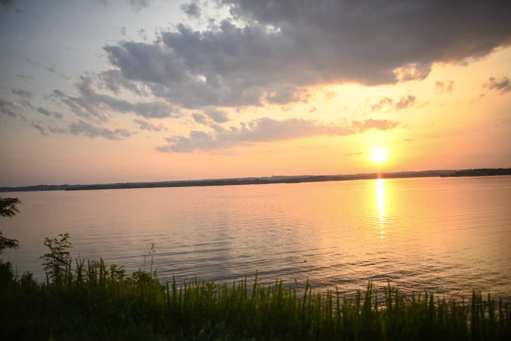 A golden sunset reflecting over a wide river near Lorton, Virginia.