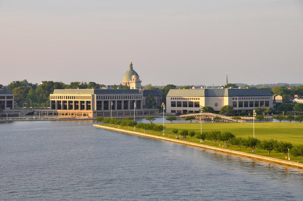 The United States Naval Academy dome and grounds seen across the water in Annapolis, Maryland