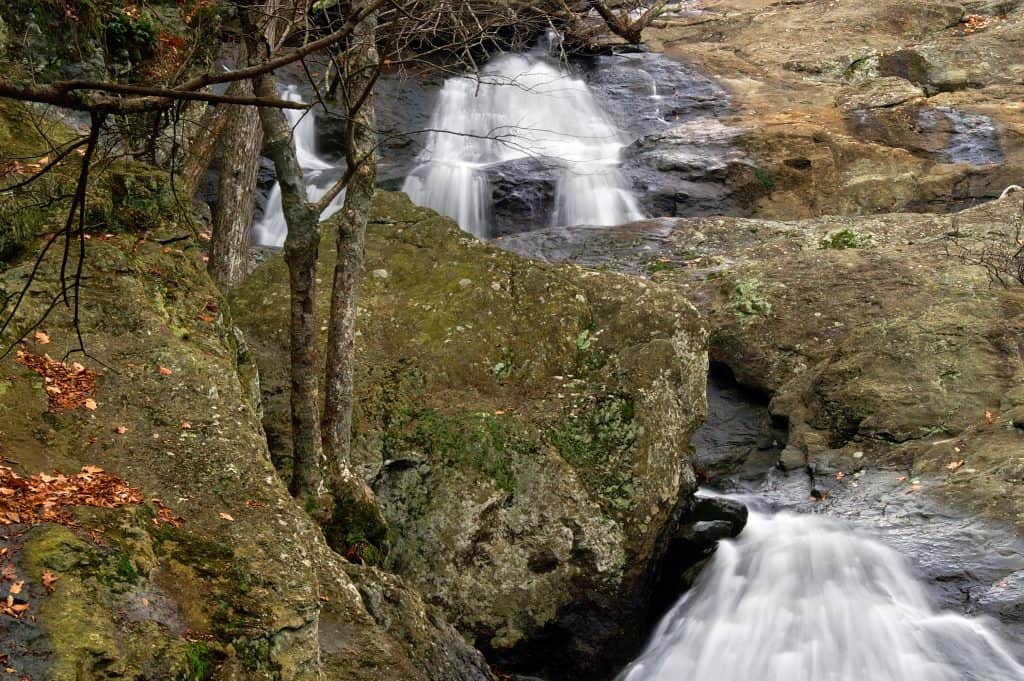 A cascading waterfall over mossy rock ledges at Cunningham Falls State Park near Thurmont, Maryland