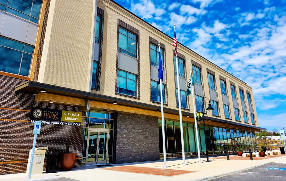 Manassas Park City Hall and Library gleams under the bright blue sky.
