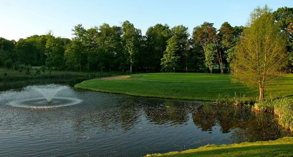 Golf course pond and fountain.