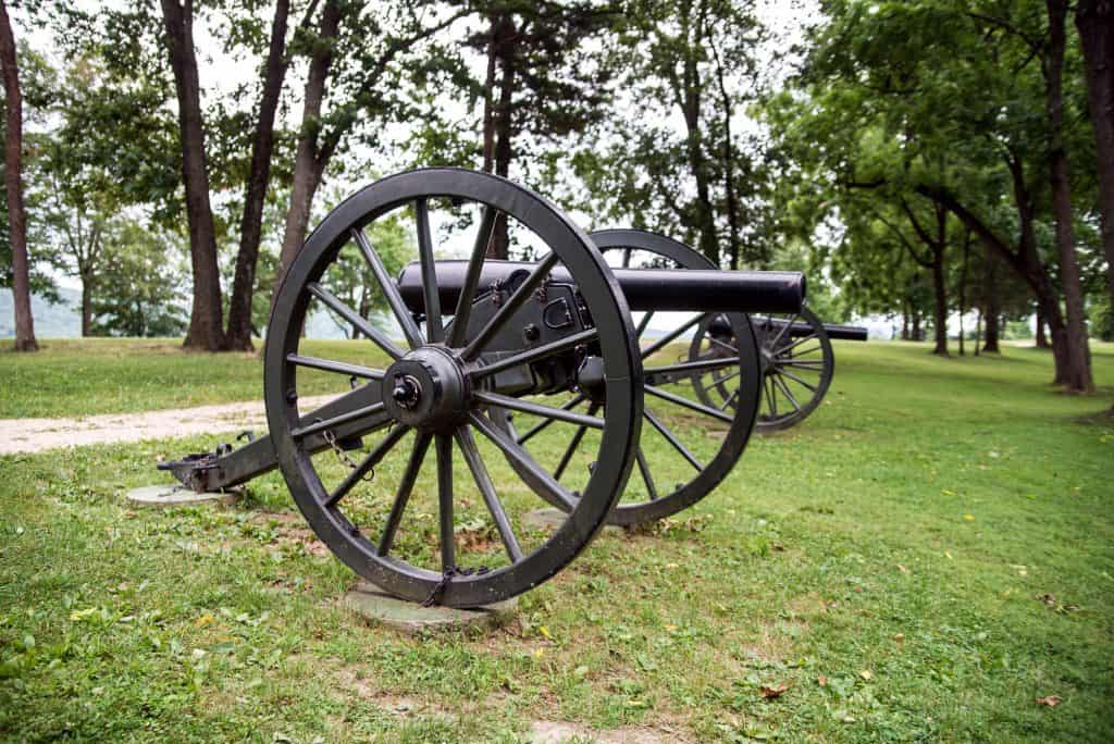A Civil War era cannon displayed among trees at a historic site in Spotsylvania County, Virginia.