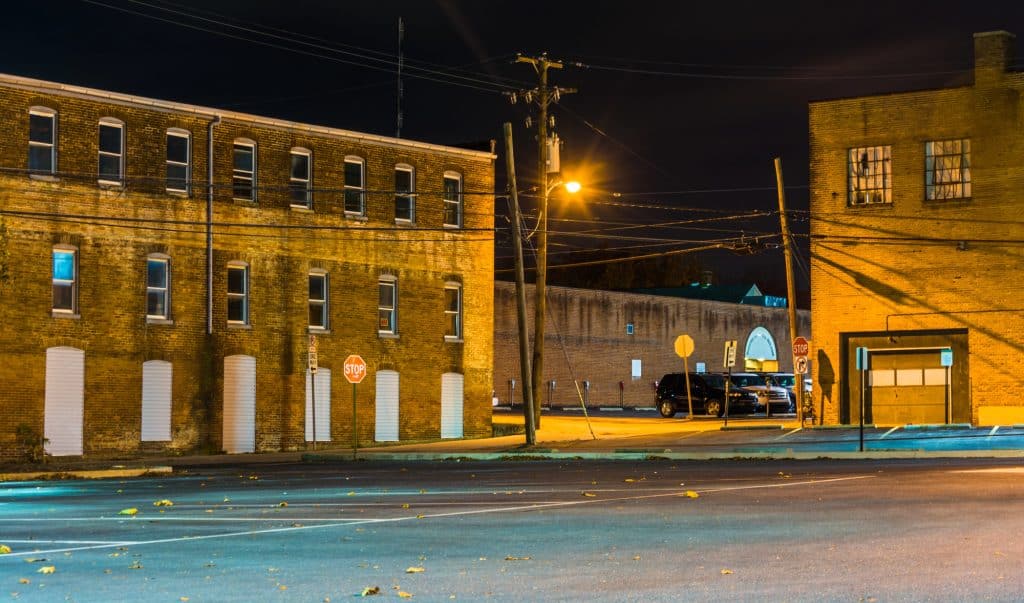 Brick buildings along an empty street lit by streetlights at night near Hanover, Pennsylvania