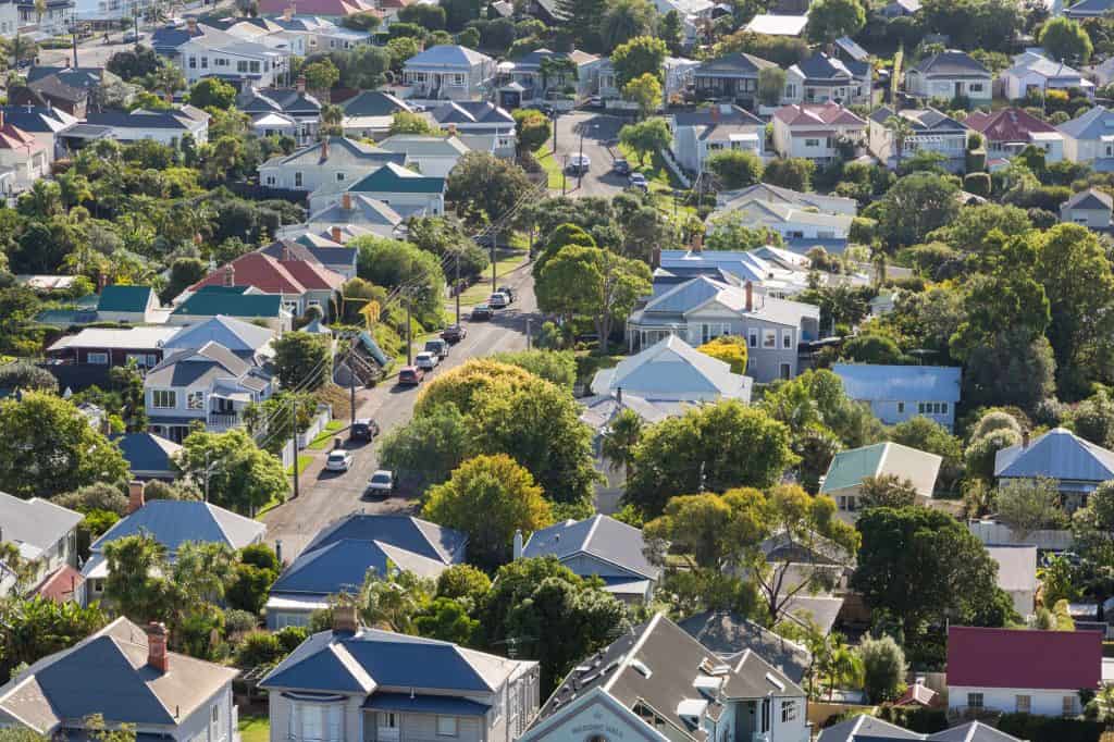 A suburban neighborhood among mature trees