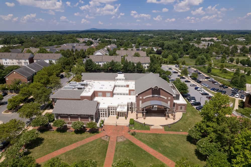 Aerial view of a brick community center building surrounded by townhomes in Germantown, Maryland