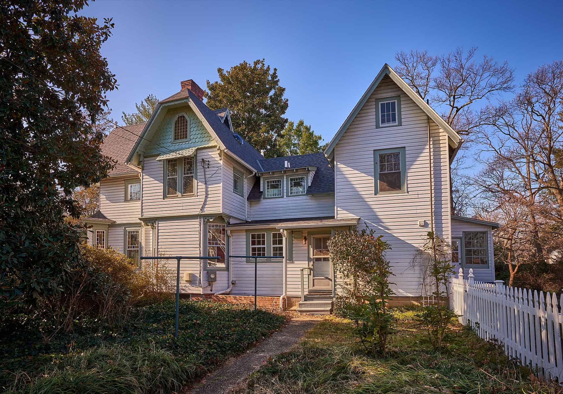 The Cory House, a Victorian frame house with a porch and picket fence in College Park, Maryland