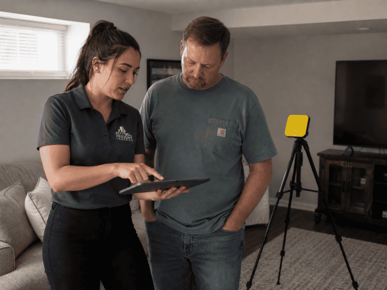 Radon technician explaining the test results to the homeowner