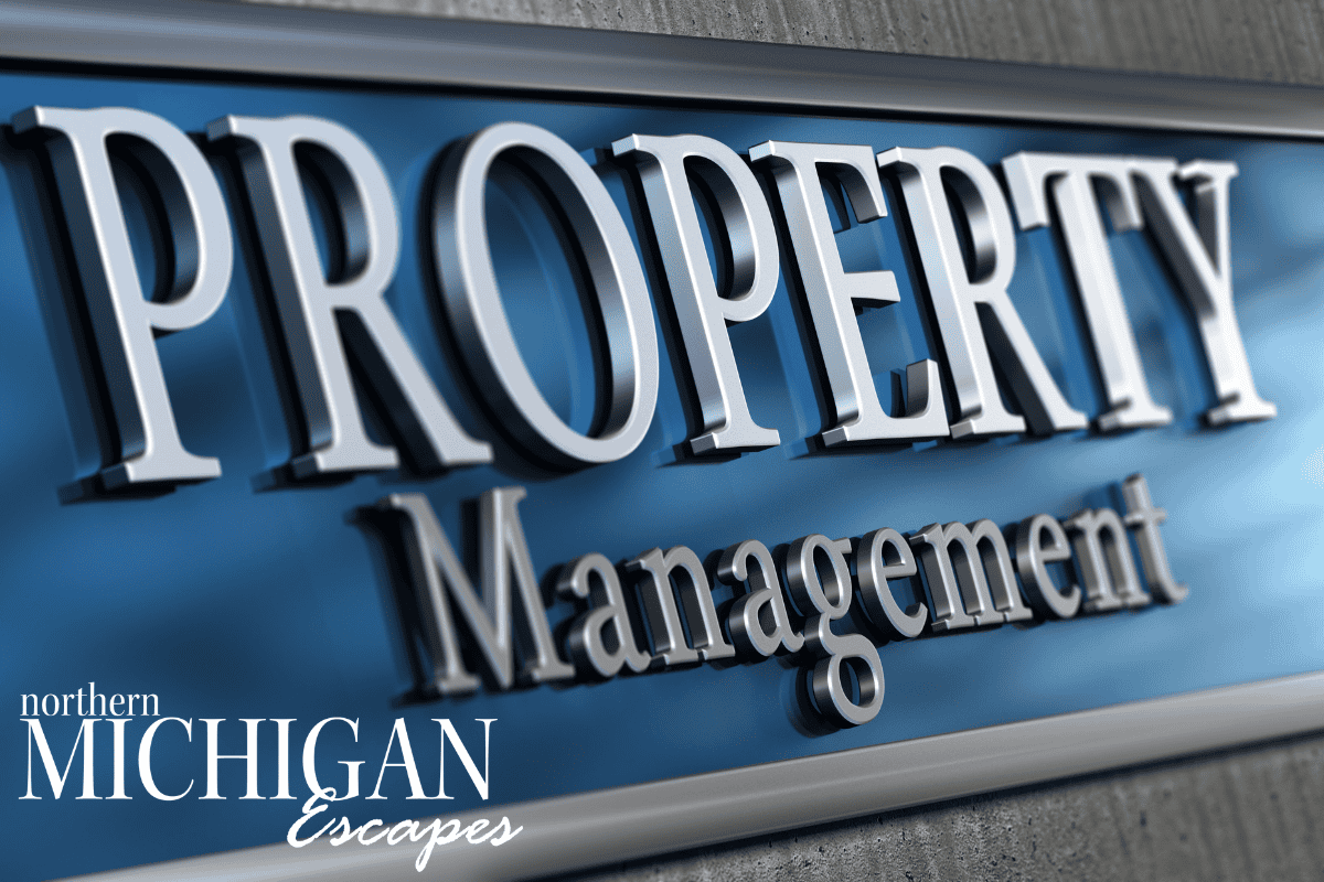 Property management office sign in Northern Michigan with bold lettering.