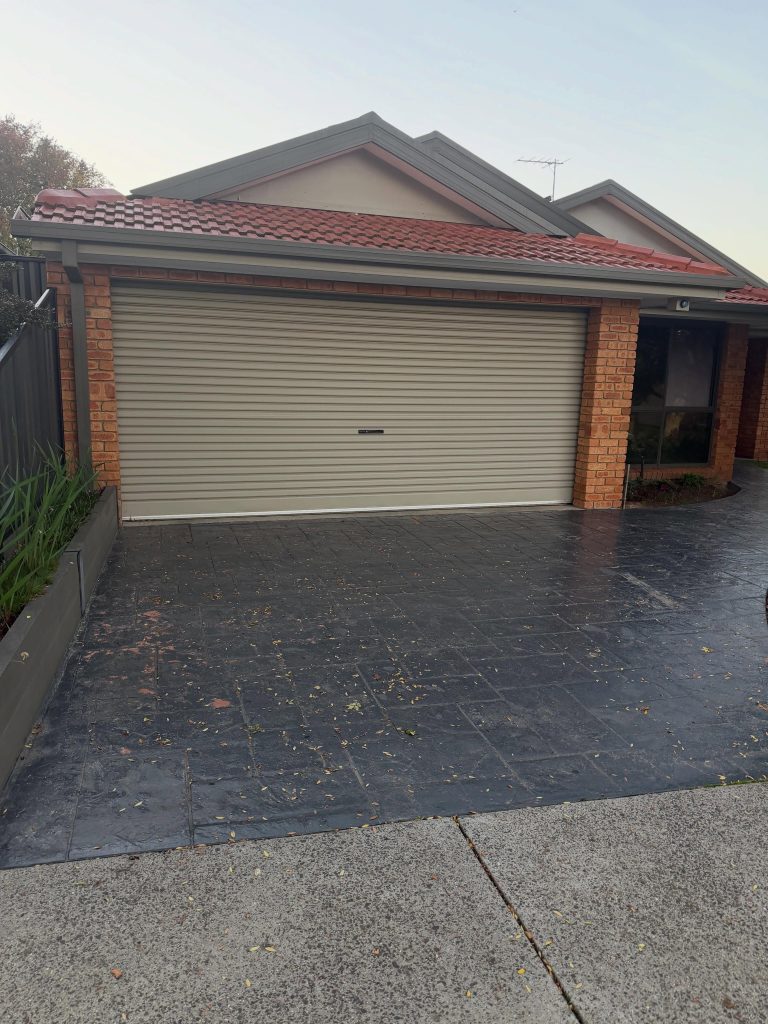 Slippery slate impression concrete driveway before resurfacing in Narre Warren