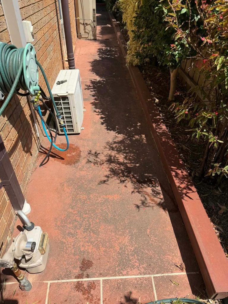 Cut stone stencil concrete pathway in Noble Park before pressure cleaning and resealing