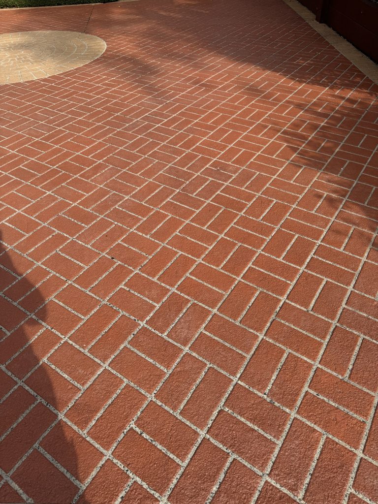 Stencil pattern concrete driveway resurfacing in Lilydale showing decorative brick finish 23 years later