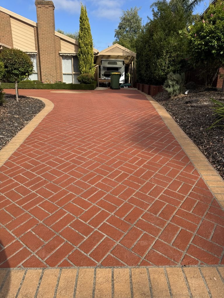 Stencil concrete resurfacing driveway photographed 23 years after installation showing long-term durability and maintained decorative finish