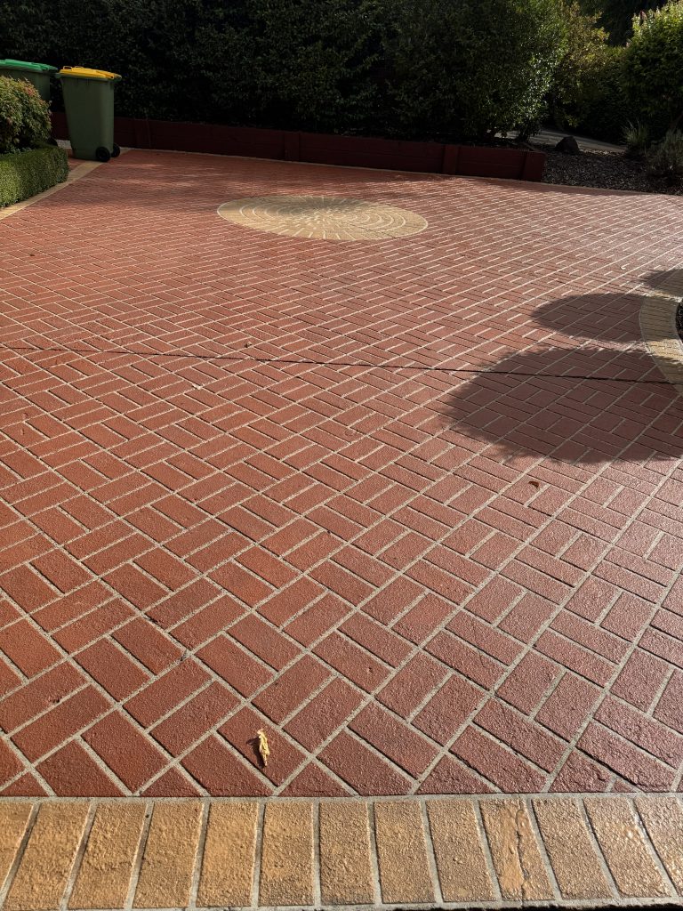 Decorative stencil concrete driveway in Lilydale photographed 23 years after resurfacing and resealing