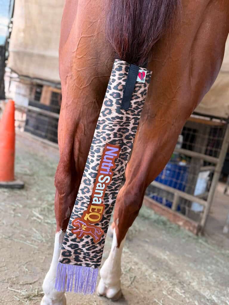 Horse tailbag with NutriSana EQ branding and leopard print design.