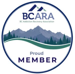 Drawing of mountains in front of trees with smooth green curve. Text says BCARA (British Columbia Addiction Recovery Association)
