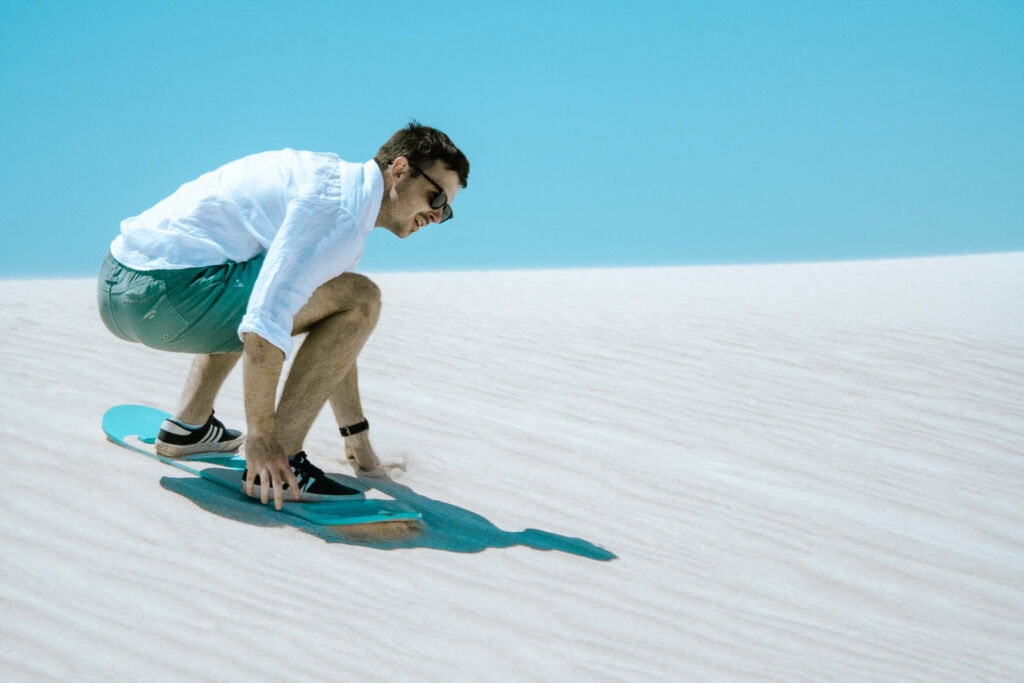 Sand boarding down the Lancelin Sand Dunes