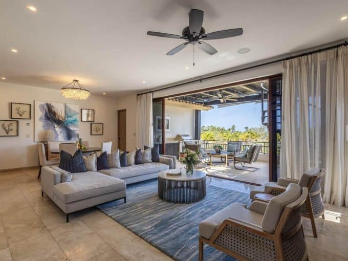 A Spacious Palmilla Living Room With Ocean Views, Elegant Furniture, And Modern Decor, Perfect For Relaxing And Entertaining In Cabo'S Luxury Lifestyle.