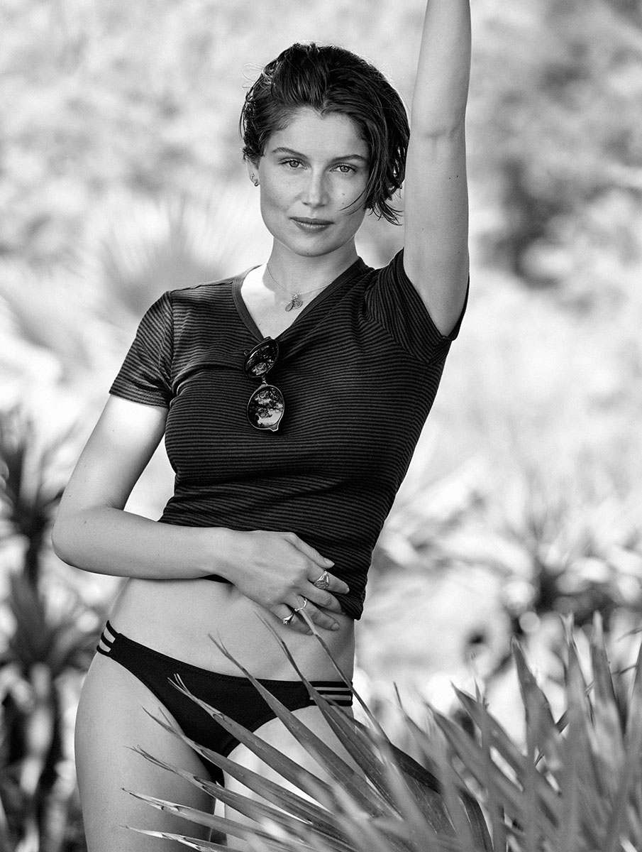 Elegant woman in black athletic wear posing outdoors, black and white photography by Pamela Hanson.