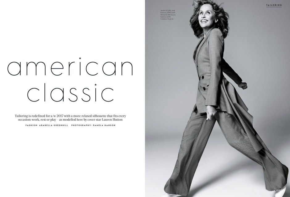 Luxurious black and white portrait of a smiling woman in elegant tailored suit, showcasing Pamela Hanson's fashion photography style.