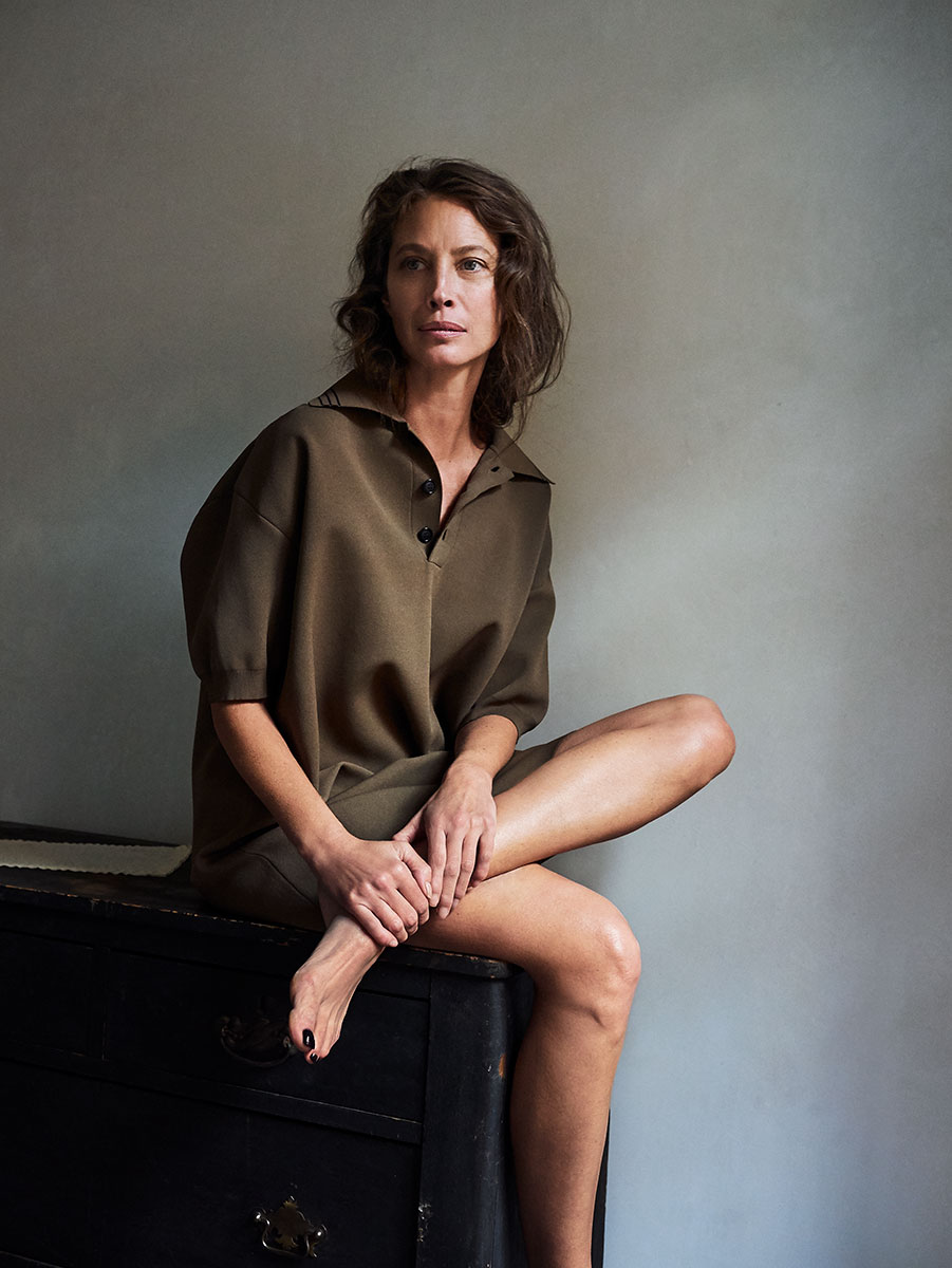 Elegant female portrait by Pamela Hanson Photography showcasing fashion, natural beauty, and artistic styling with a minimalistic background.