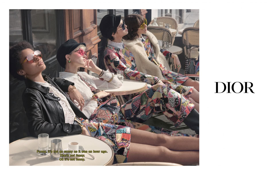 Sunglasses fashion shoot featuring diverse women in stylish eclectic outfits, relaxing outdoors at a Parisian café for luxury fashion photography.