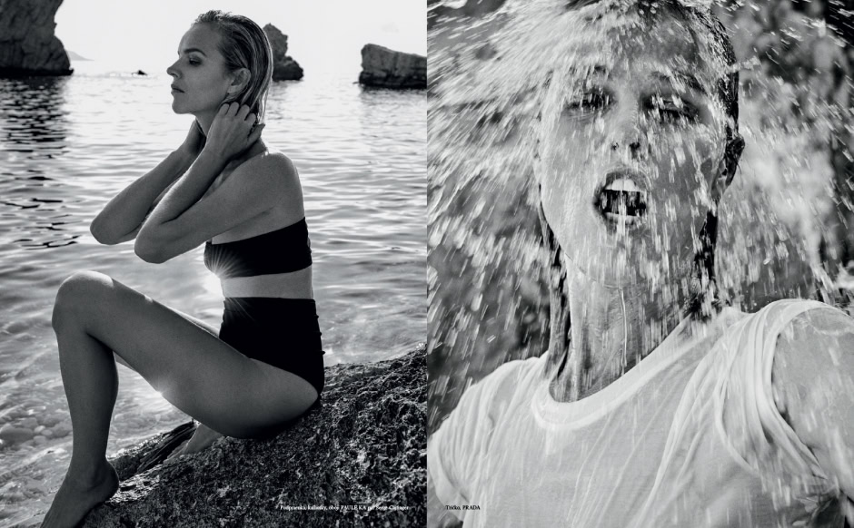 Elegant woman sitting on rocks by the sea in a black swimsuit, black and white photography, serene coastal landscape, high fashion coastal photography, Pamela Hanson Photography.