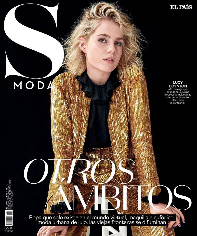 Gold metallic blazer fashion editorial, elegant model portrait, luxury urban fashion, high-end clothing photography, contemporary fashion magazine shot, sophisticated style and glamour, stylish model with confident expression, artistic and fashionable photography, high-resolution editorial image, premium fashion magazine cover, stylish women in luxury attire, modern fashion trends, professional model photography, upscale fashion editorial for magazines.
