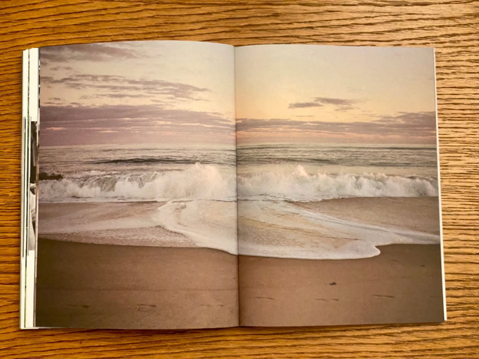 Serene sunset beach scene with gentle waves crashing onto the sandy shore, capturing the tranquil and romantic atmosphere.