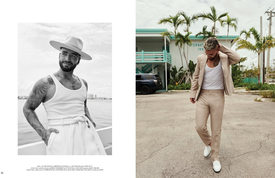 Stylish male model in linen blazer and beige trousers outdoors, palm trees and retro motel in background, fashion photography.