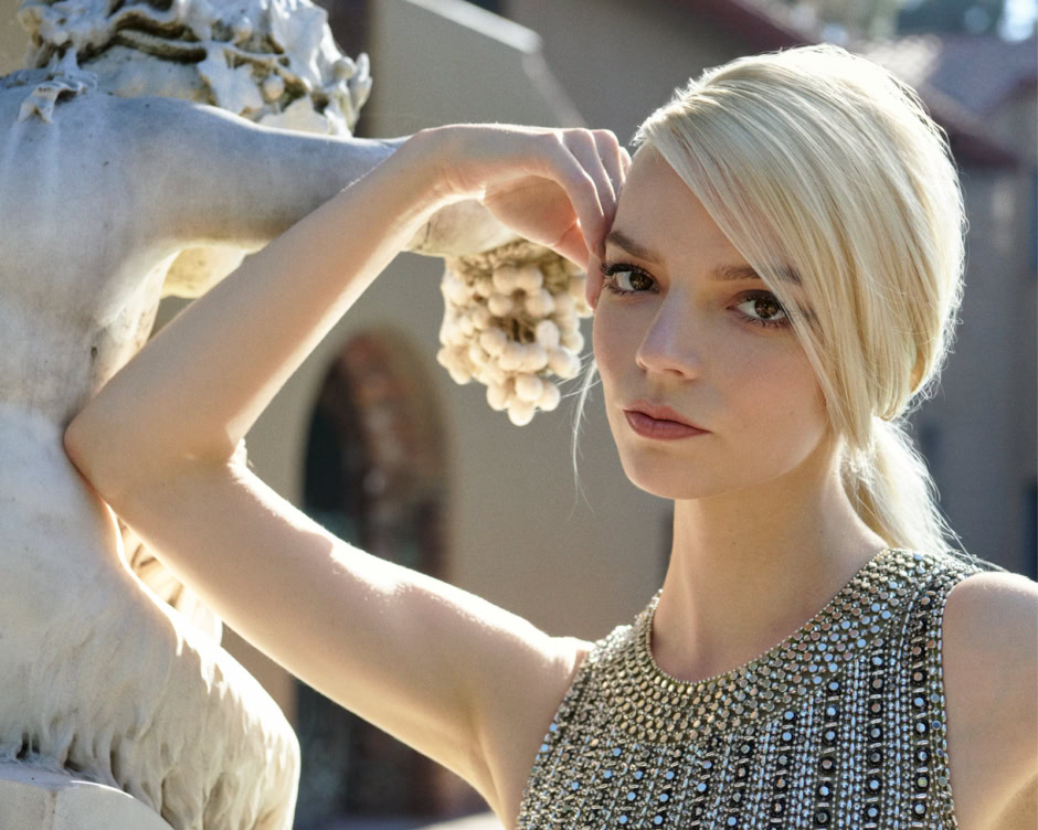 Elegant blonde woman wearing a beaded dress standing next to a classical marble statue, outdoor portrait, high fashion photography.
